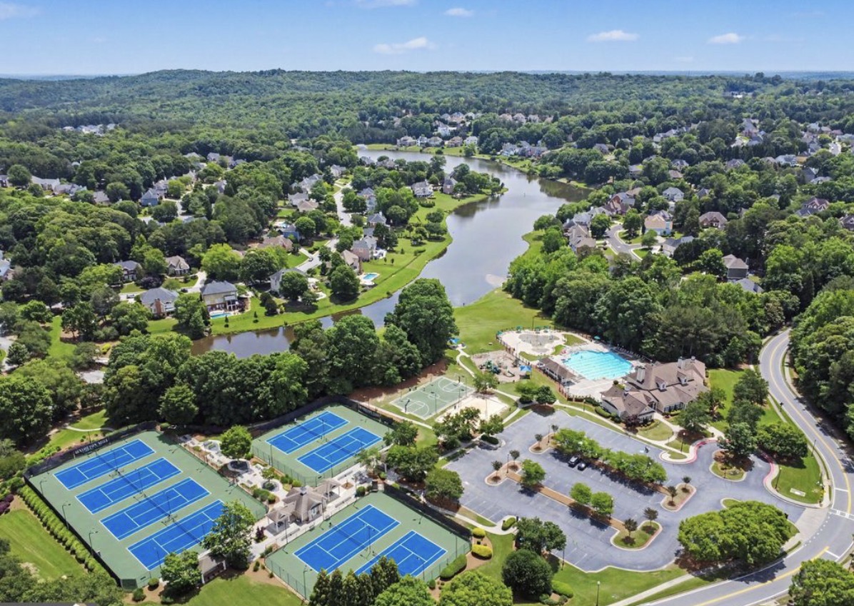 Aerial view of Hamilton Mill homes, lake, pool and tennis courts