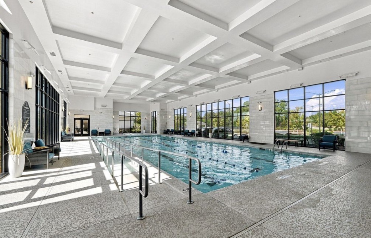 Indoor lap pool with coffered ceiling at Del Webb Chateau Elan