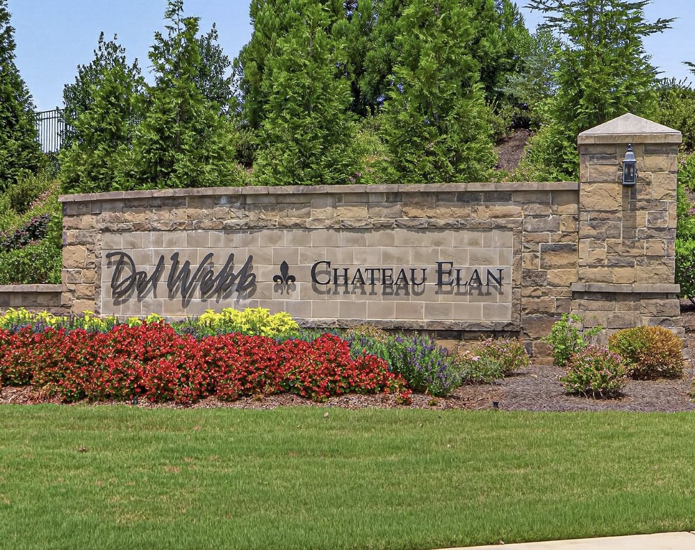 Del Webb Chateau Elan stone entrance sign with flower beds