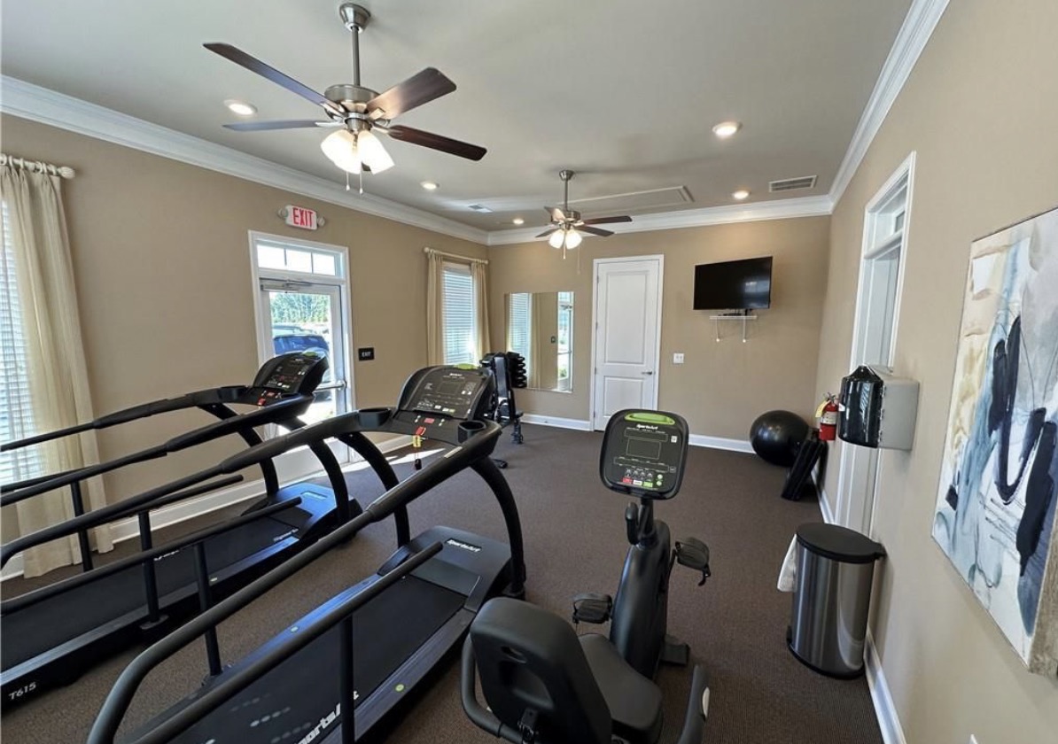 Orchards of South Forsyth fitness room with treadmills and exercise equipment