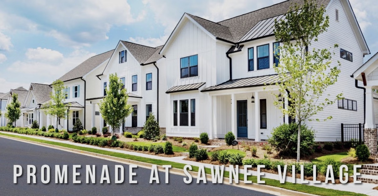 White homes with front porches at Promenade at Sawnee Village