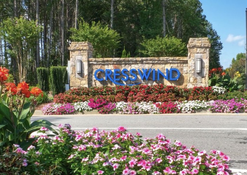 Cresswind at Twin Lakes stone entrance sign with flower beds