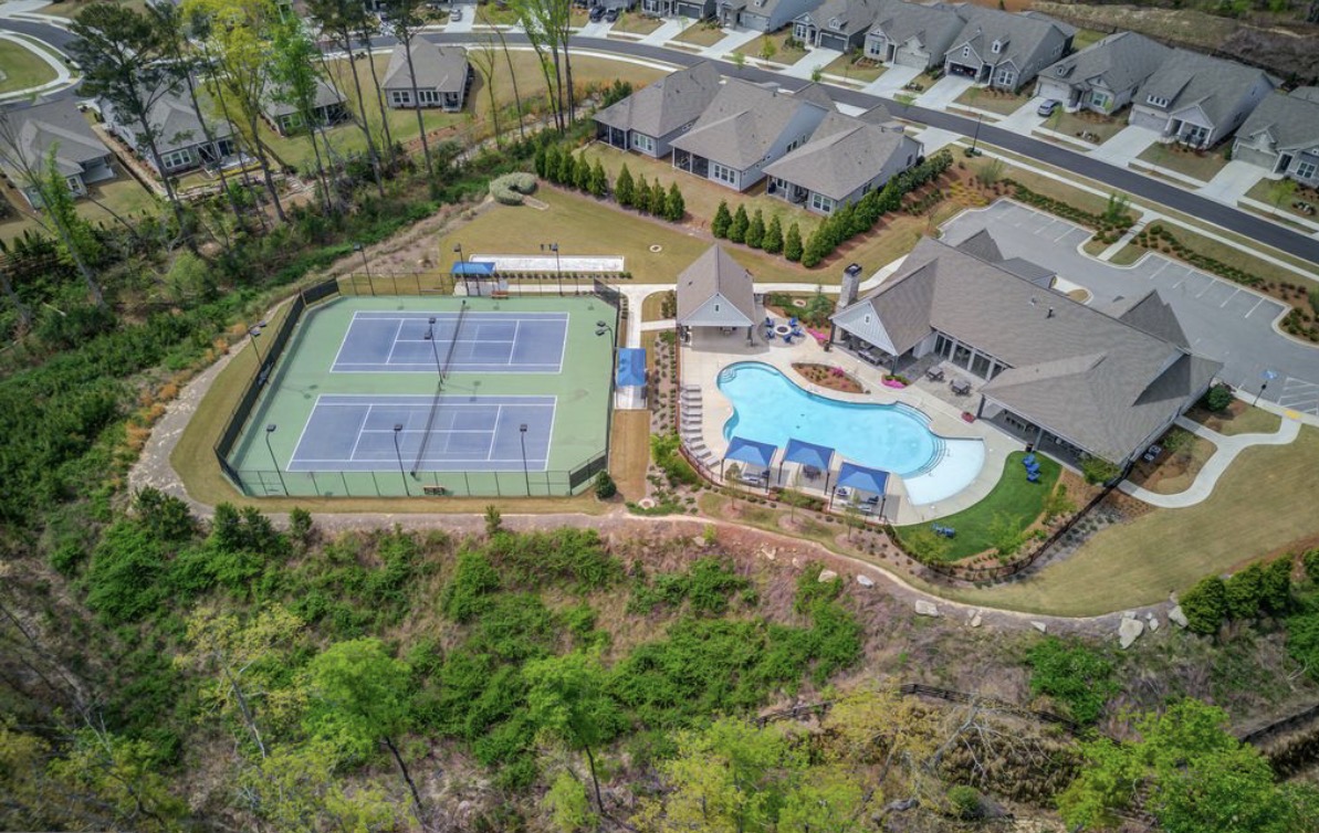 Aerial view of The Retreat at Sterling on the Lake clubhouse, pool and tennis courts