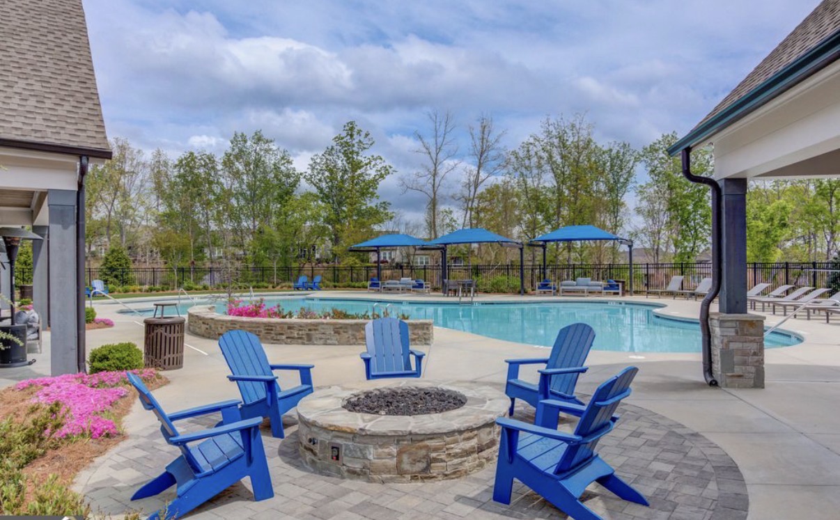 The Retreat at Sterling on the Lake pool with fire pit and shaded seating