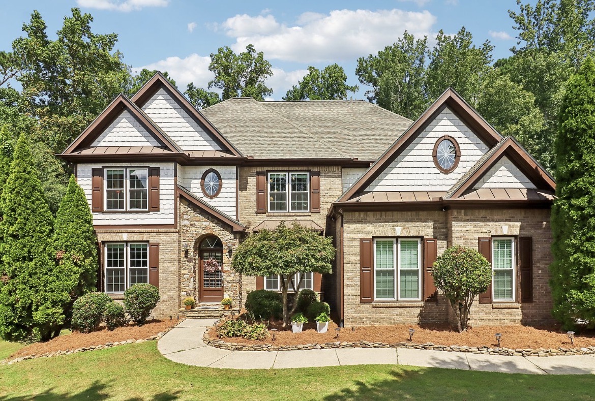 Brick and shake two-story home in The Hedgerows