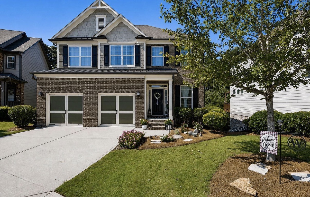Two-story brick and shake home in Sterling on the Lake