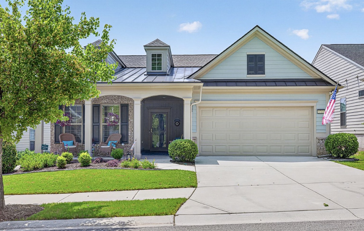Single-level home with stone porch arches in Del Webb Chateau Elan