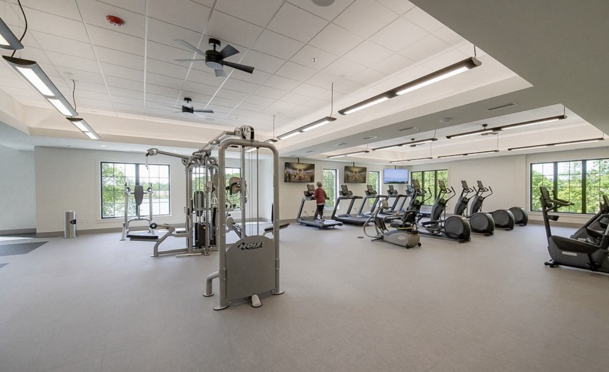 Fitness center with cardio and weight equipment at Cresswind at Twin Lakes