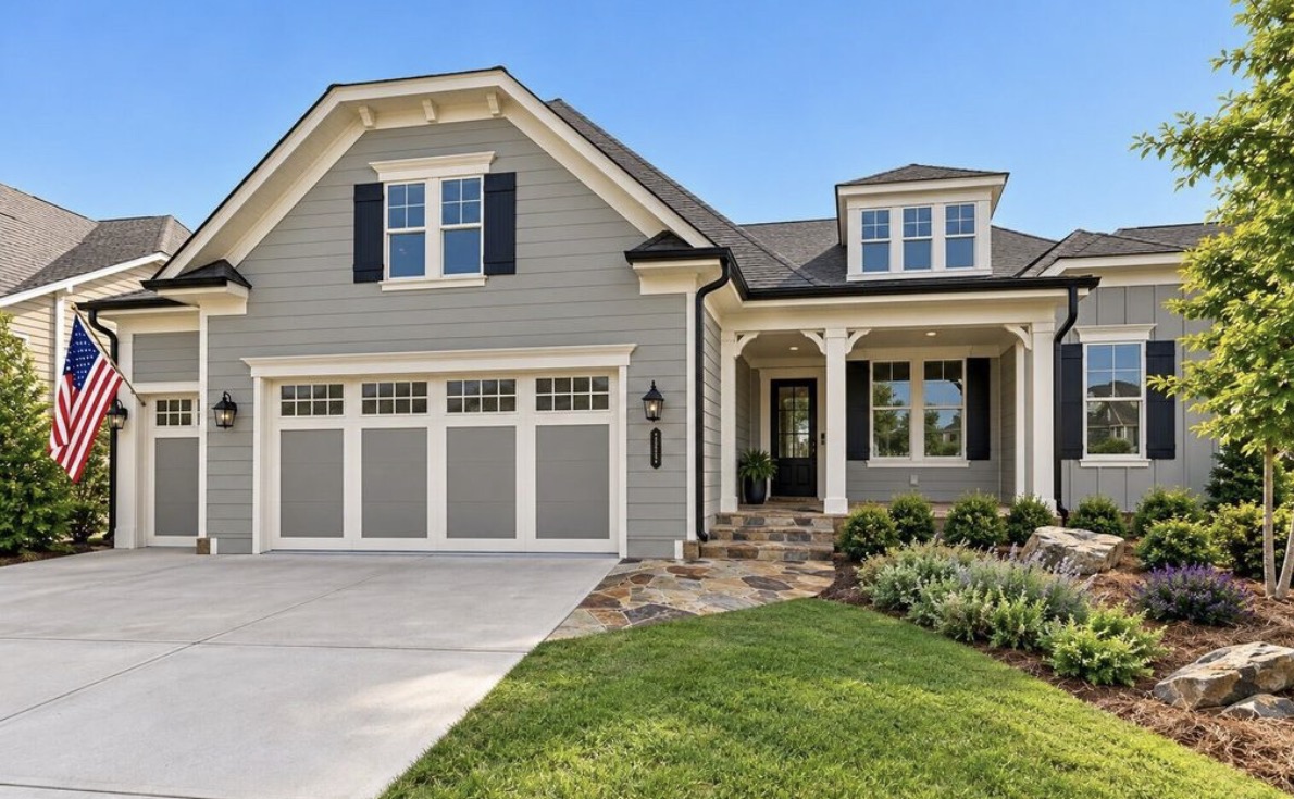 Gray craftsman home with stone walkway in Cresswind at Twin Lakes